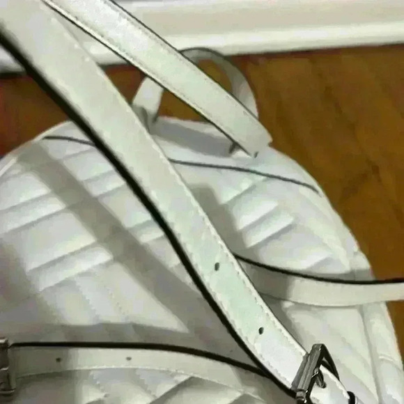 Michael Kors Abbey white quilted backpack. Silver hardware. Two zipper pockets. - Picture 10 of 12